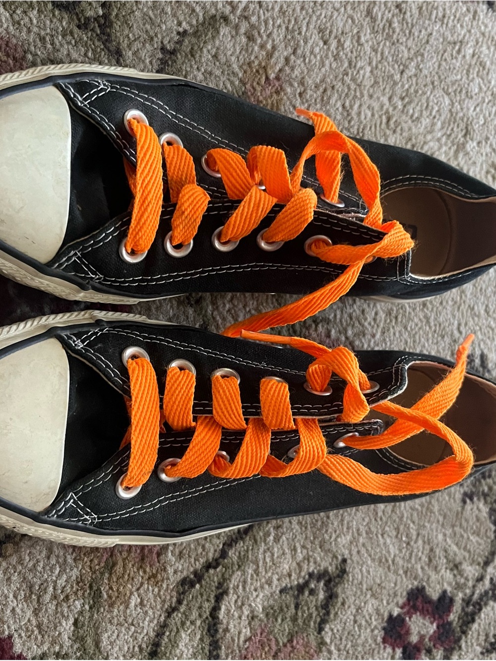 Classic Black Canvas Sneakers with Bright Orange Laces